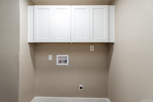 washroom with hookup for a washing machine, cabinet space, and hookup for an electric dryer