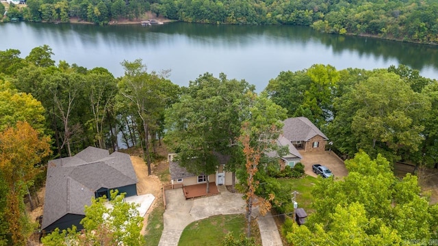 bird's eye view with a forest view and a water view