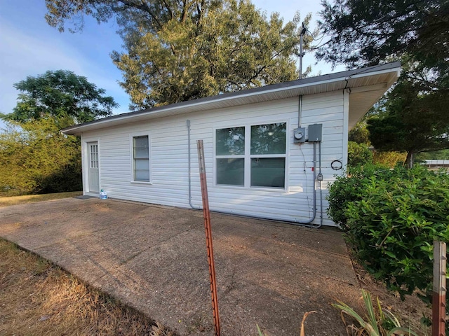 back of property with a patio