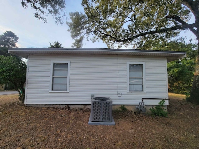 view of home's exterior with central AC