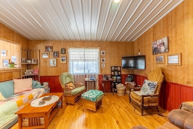 living room featuring wood finished floors and wainscoting