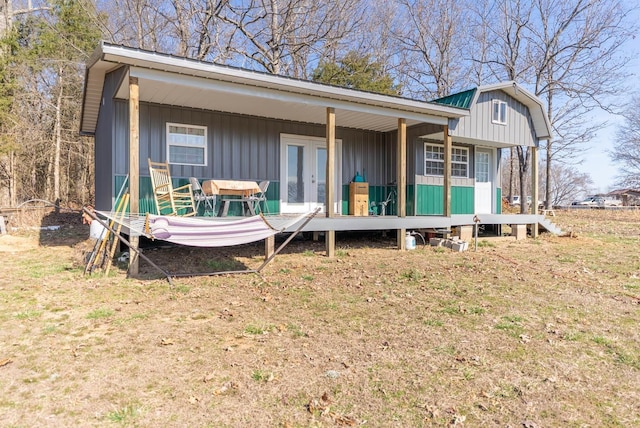 view of front of home with french doors and board and batten siding