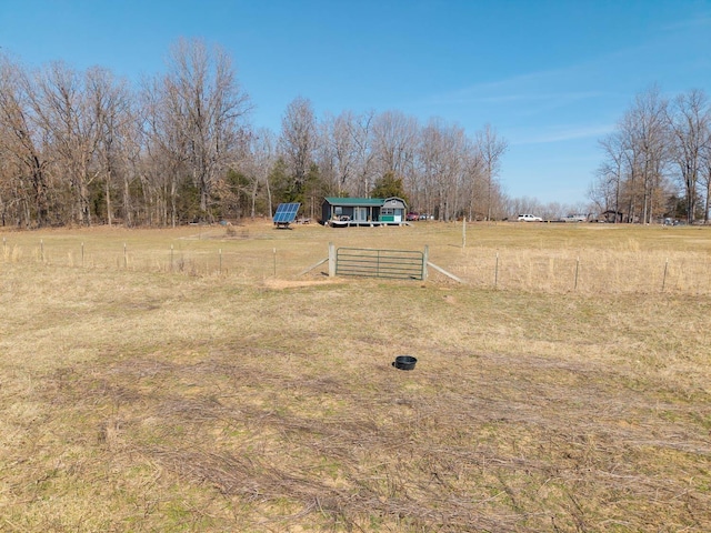 view of yard with an outbuilding and fence