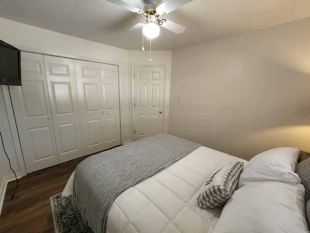 bedroom with dark wood-style floors, a closet, and ceiling fan