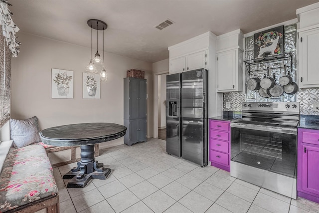 kitchen featuring visible vents, stainless steel electric stove, tasteful backsplash, black fridge with ice dispenser, and dark countertops