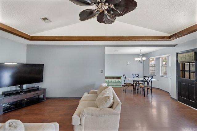 living room with visible vents, a textured ceiling, and vaulted ceiling