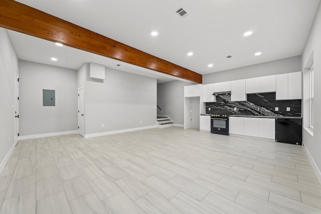 kitchen with beam ceiling, electric panel, decorative backsplash, black appliances, and dark countertops