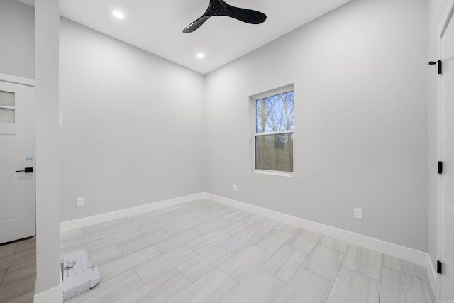 unfurnished room with recessed lighting, a ceiling fan, and baseboards