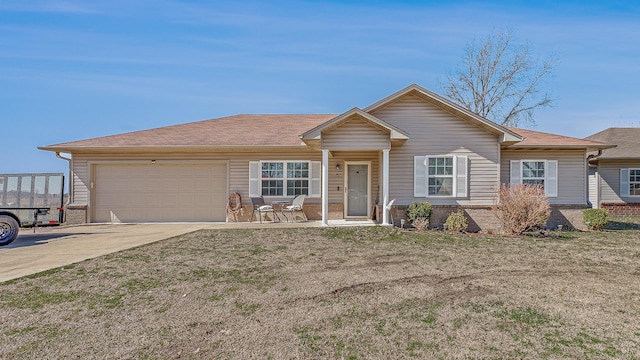 single story home featuring a front lawn, an attached garage, brick siding, and driveway