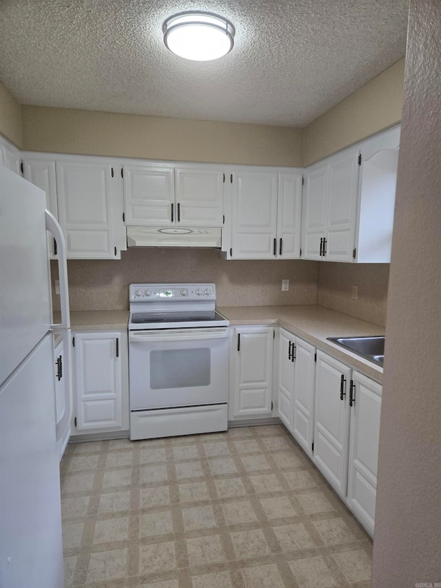 kitchen with white appliances, light floors, a sink, light countertops, and under cabinet range hood