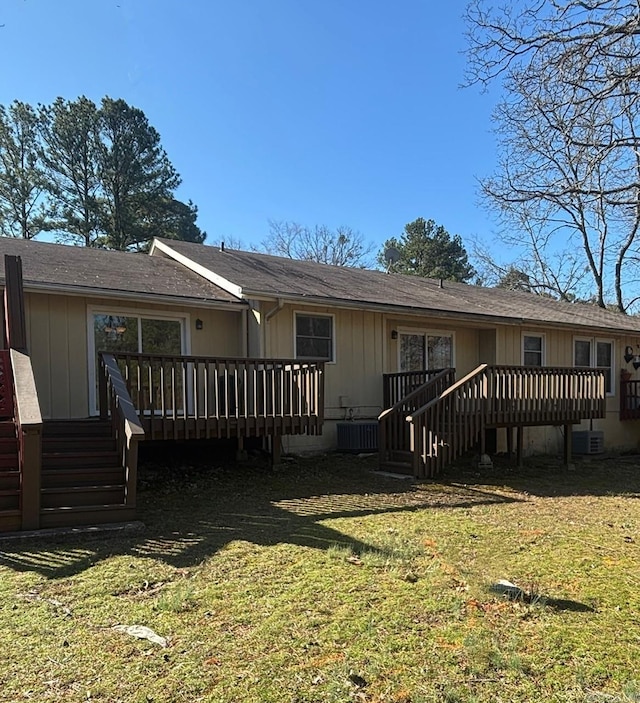 exterior space featuring central AC, a deck, and a front yard