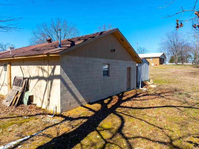 view of home's exterior featuring concrete block siding