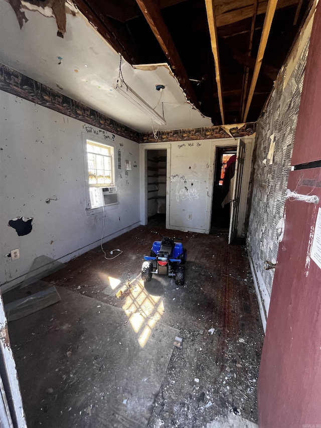 interior space with cooling unit and a garage