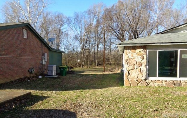 view of yard featuring central AC