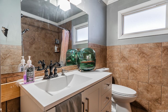 full bathroom with vanity, a shower with curtain, crown molding, tile walls, and toilet