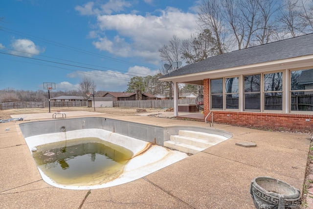 view of swimming pool featuring a patio area, a jacuzzi, fence, and a fenced in pool