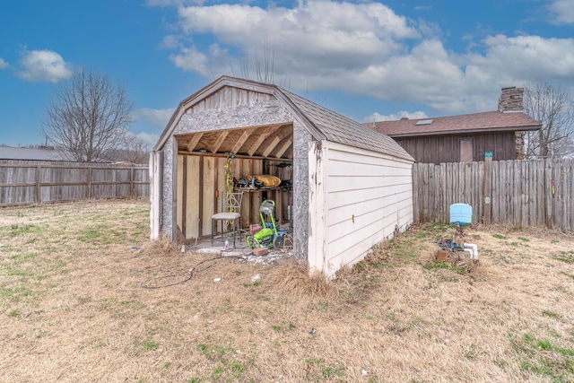 view of shed featuring a fenced backyard