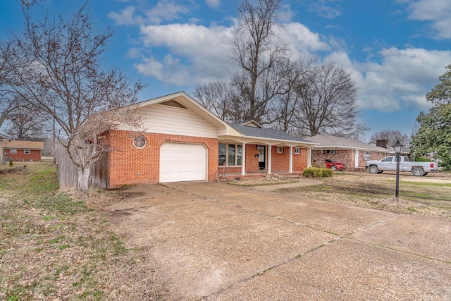 ranch-style house featuring driveway, brick siding, and an attached garage