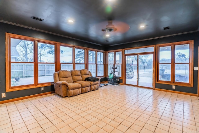 interior space featuring light tile patterned floors, visible vents, baseboards, recessed lighting, and crown molding