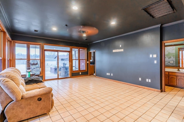 interior space featuring visible vents, baseboards, light tile patterned flooring, and crown molding