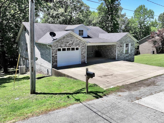 view of front of house with brick siding, a front lawn, cooling unit, a garage, and driveway