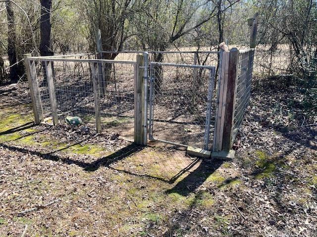 view of gate featuring fence