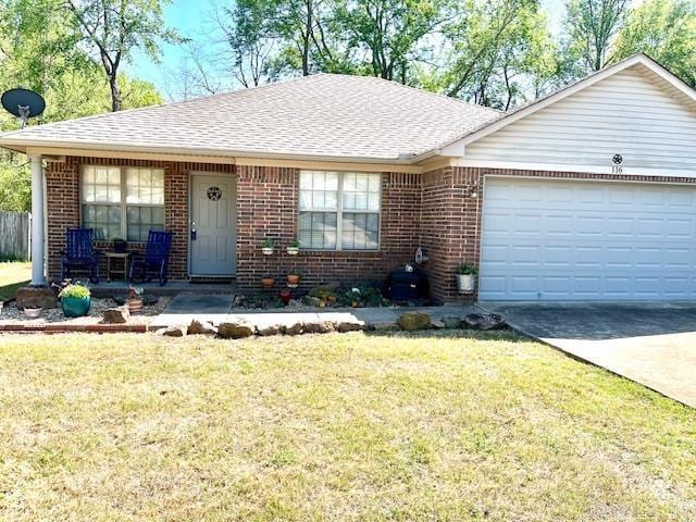 view of front of home featuring covered porch, a front yard, brick siding, an attached garage, and concrete driveway