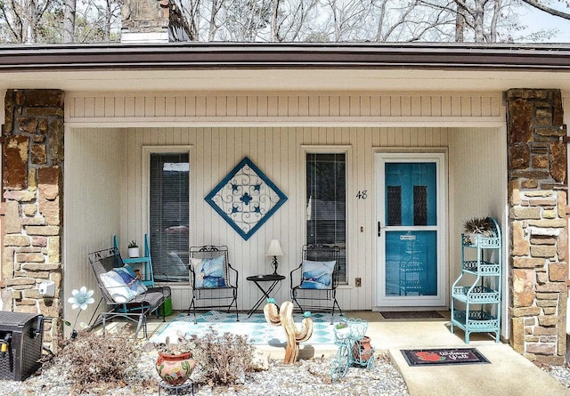 entrance to property featuring stone siding