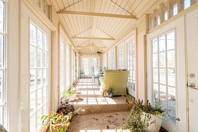 sunroom featuring lofted ceiling