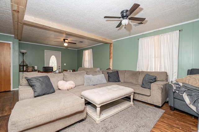 living room with visible vents, crown molding, a ceiling fan, and wood finished floors