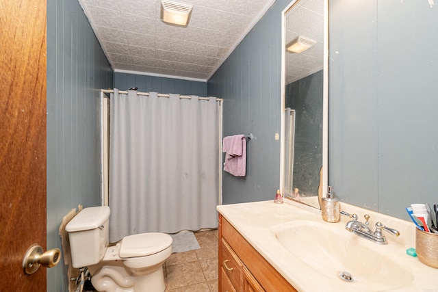 bathroom featuring vanity, curtained shower, toilet, and tile patterned flooring