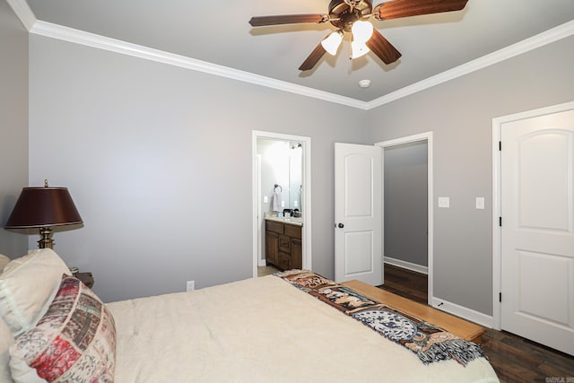 bedroom with a ceiling fan, wood finished floors, baseboards, ornamental molding, and connected bathroom