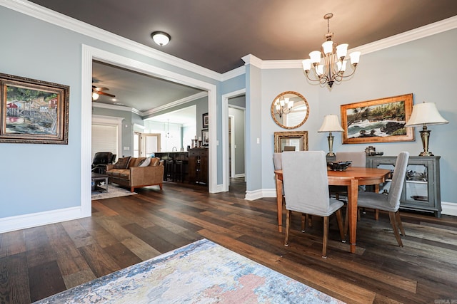 dining room with baseboards, a chandelier, dark wood-style flooring, and ornamental molding