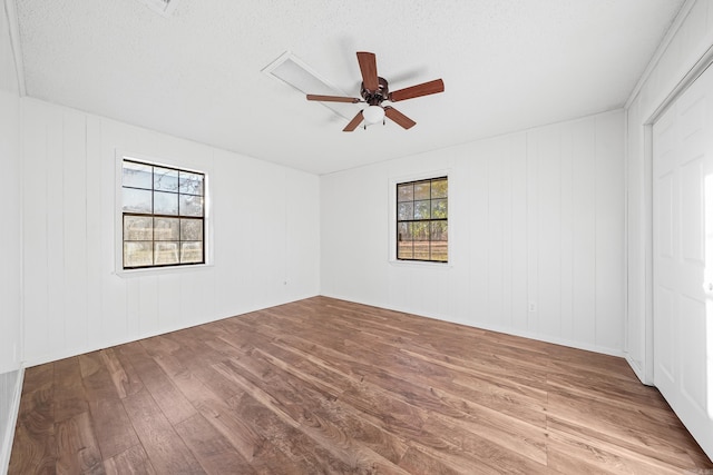 spare room featuring a ceiling fan and wood finished floors