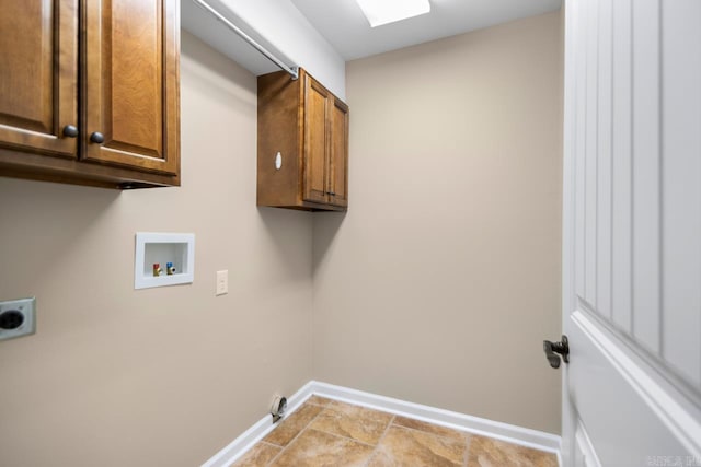 washroom with washer hookup, cabinet space, baseboards, and hookup for an electric dryer