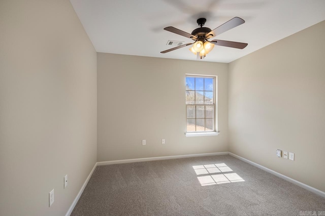 unfurnished room with visible vents, baseboards, carpet, and ceiling fan