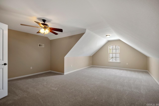 bonus room with visible vents, carpet floors, and vaulted ceiling