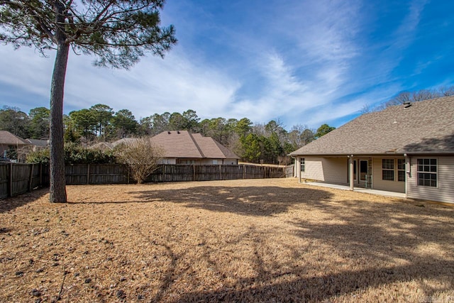 view of yard featuring a patio and a fenced backyard