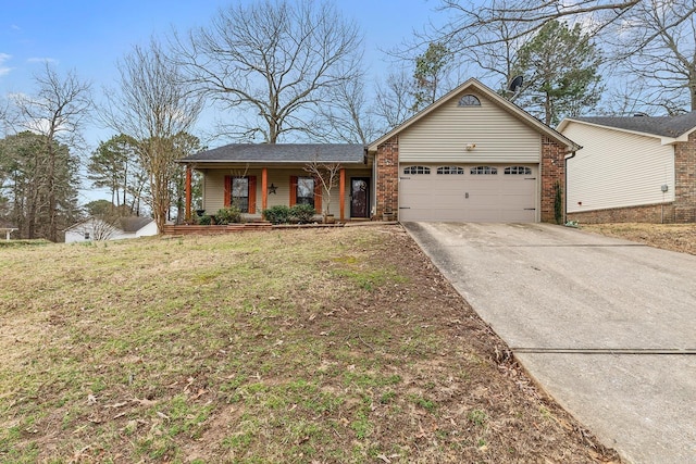 single story home with brick siding, a front lawn, a porch, a garage, and driveway