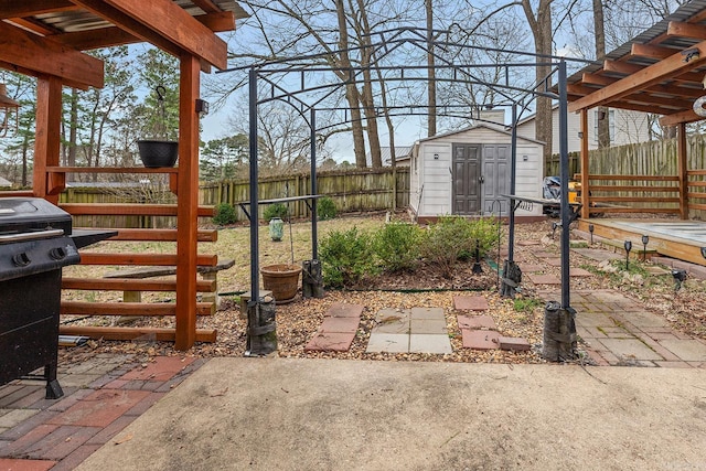 view of yard with an outbuilding, a storage shed, and a fenced backyard