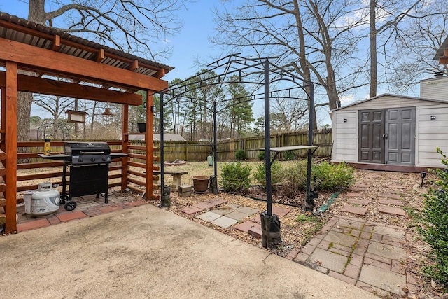 view of yard with an outbuilding, a pergola, a patio, a shed, and fence private yard