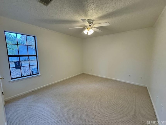 unfurnished room featuring visible vents, a ceiling fan, a textured ceiling, baseboards, and light colored carpet