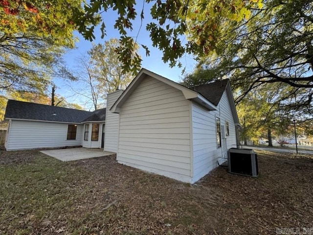 rear view of property featuring a patio and central AC unit