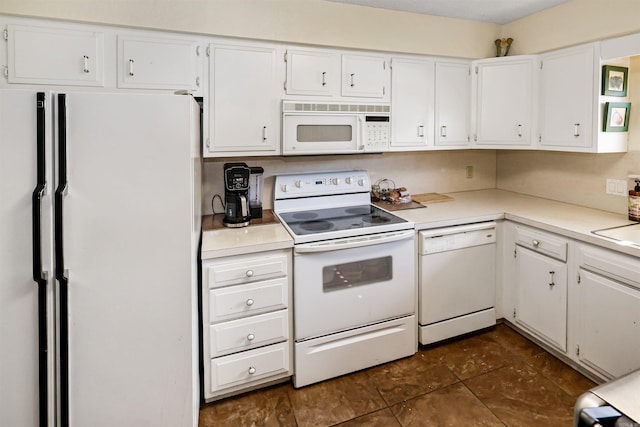 kitchen featuring white cabinets, white appliances, and light countertops