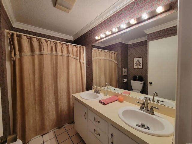 bathroom featuring wallpapered walls, crown molding, and a sink