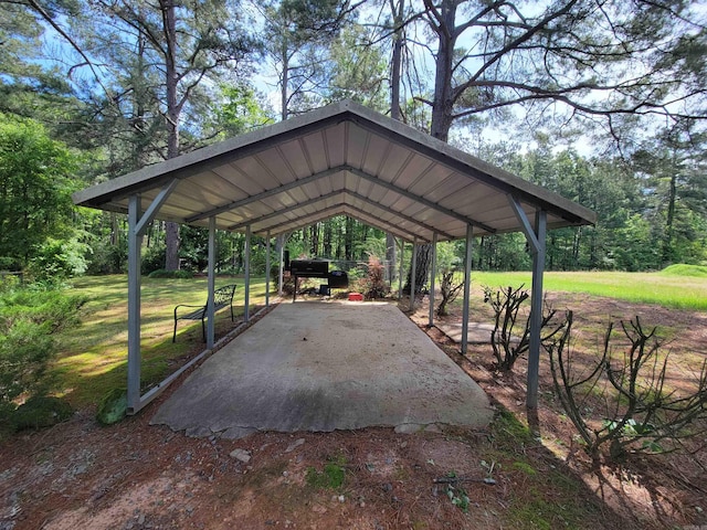 view of parking / parking lot featuring a carport