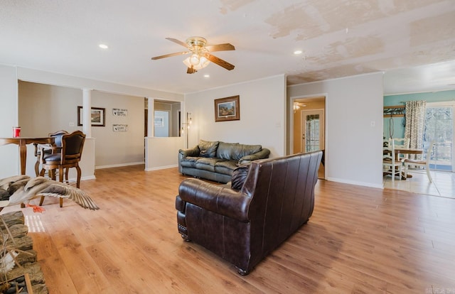 living area with light wood finished floors, recessed lighting, baseboards, and ceiling fan