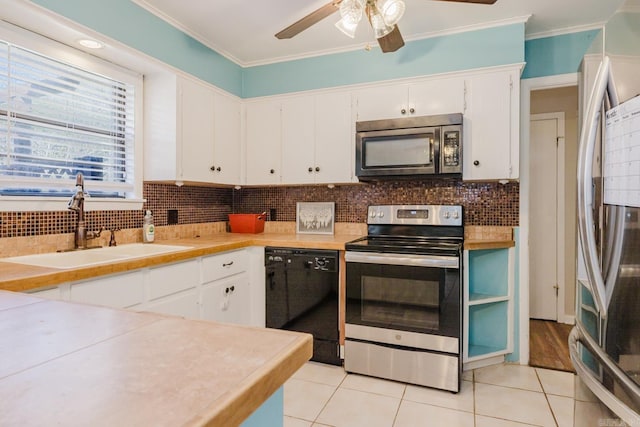 kitchen with a sink, ornamental molding, tasteful backsplash, and stainless steel appliances