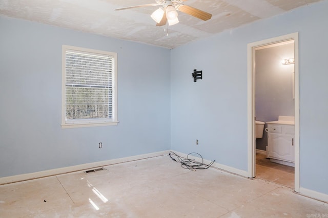 unfurnished room featuring visible vents, baseboards, and a ceiling fan