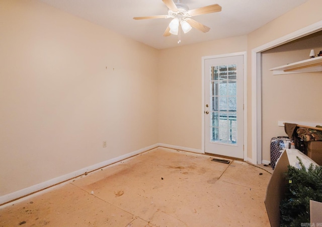 interior space with visible vents, ceiling fan, and baseboards